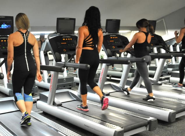 woman using treadmills at a no wait cardio gym in montrose modern equipment