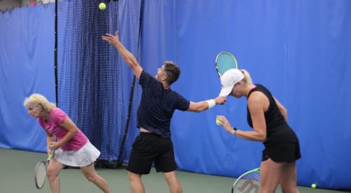 adults at a tennis court in montrose gym premier athletic club