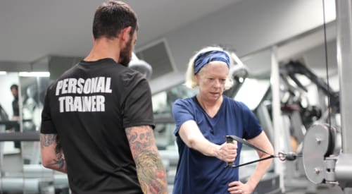 a woman in Montrose with a certified personal trainer from premier athletic club gym near me training