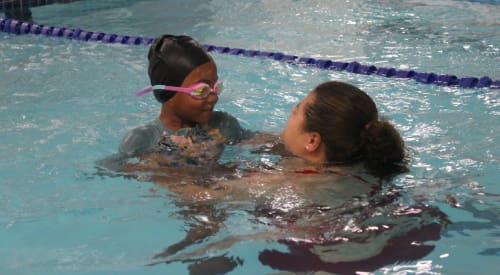 kid taking a swimming lesson at premier athletic club near me montrose