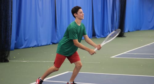 boy playing on a kids tennis court in montrose