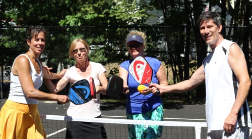 group of friends playing pickleball at the Montrose racquet courts near me tennis gyms