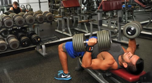 man weight lifting at premier athletic club in Montrose strength training gym