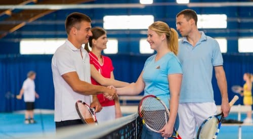 tennis players meet at the net and exchange hand shakes after a tennis league match in montrose