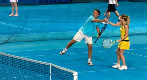 doubles tennis players celebrate between sets during a tennis league in montrose
