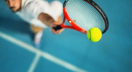 a tennis player serves at a fitness center in montrose