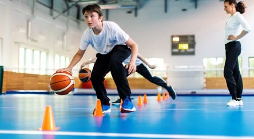 kids being coached in basketball summer camp at montrose gym