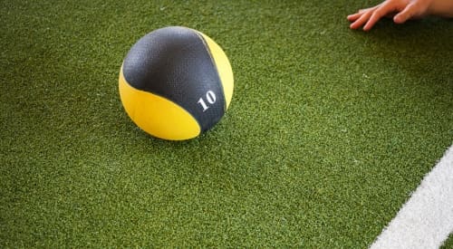medicine ball being used on functional turf area in montrose gym