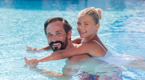 father and daughter at a outdoor pool in montrose at a gym near me