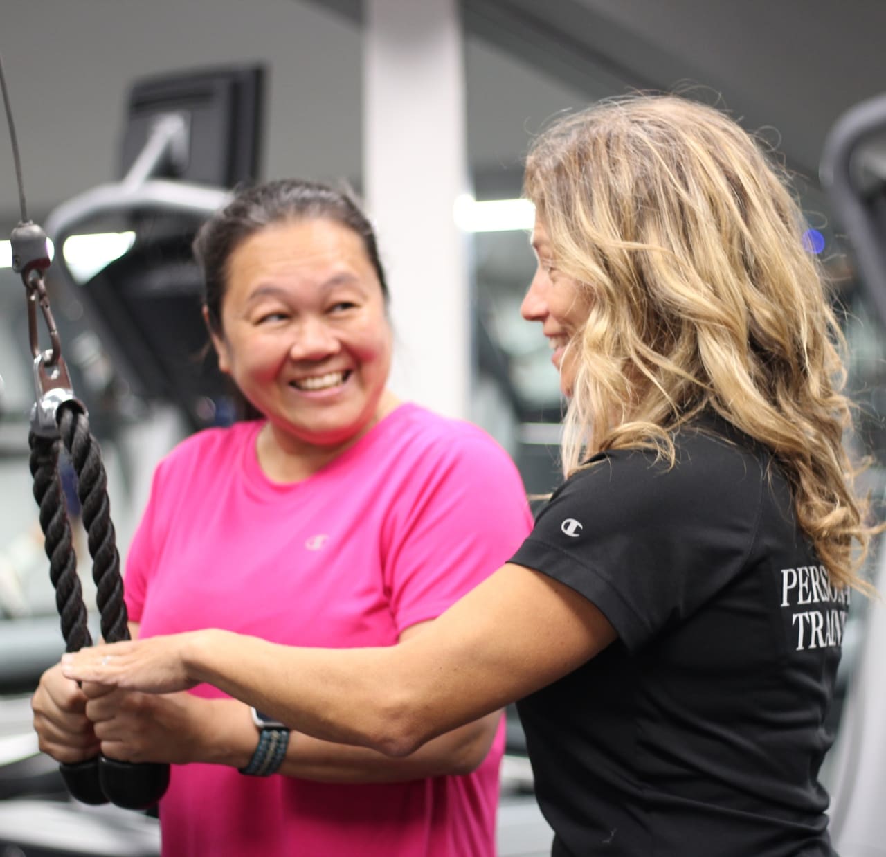 certified personal trainer helping member in montrose gym