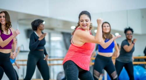 woman gym member zumba group class in montrose near me premier athletic club